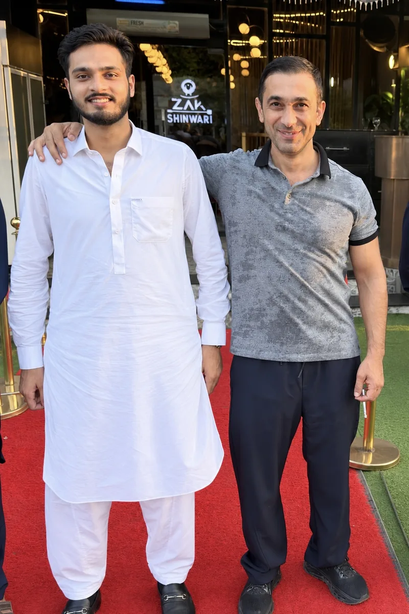Daim Ali and Mr. Babak together outside the Zak Shinwari restaurant in Sialkot