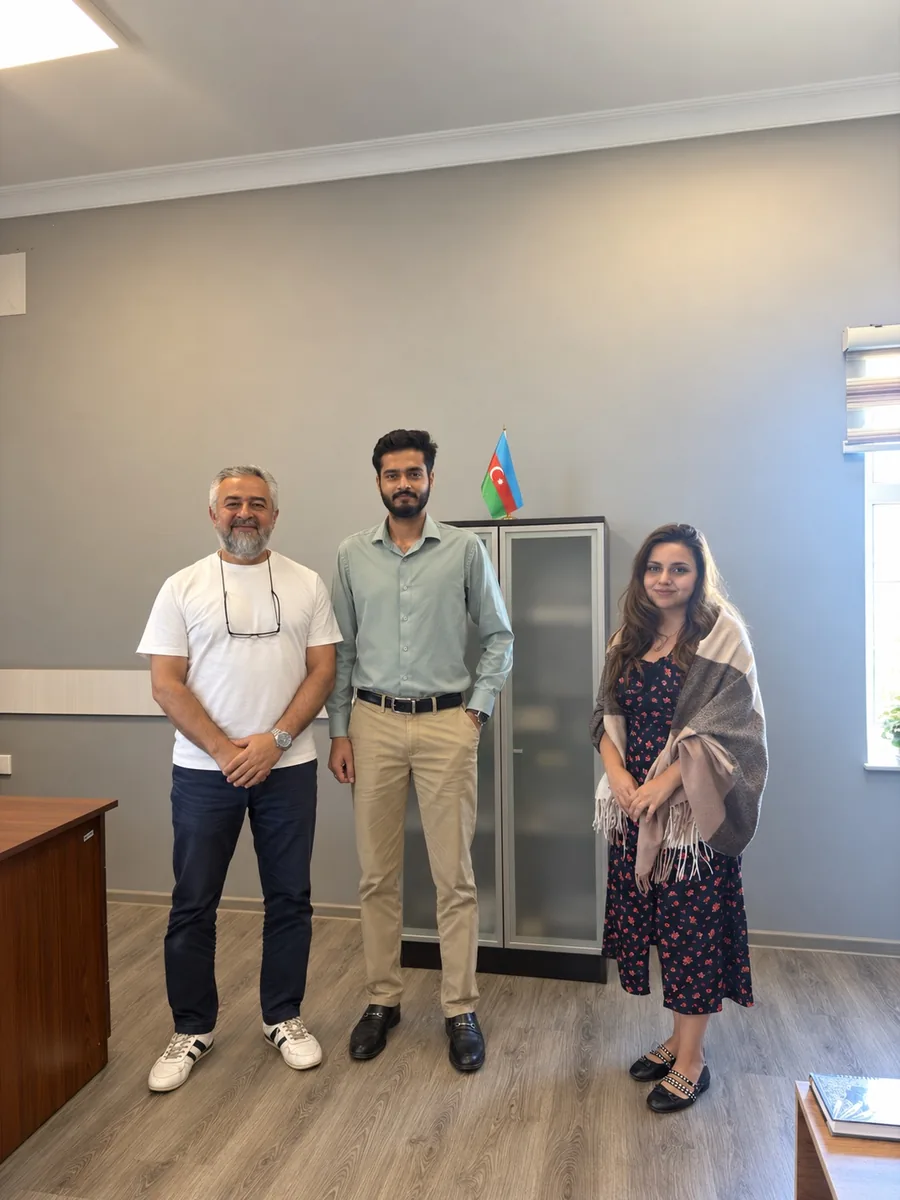 Terra Pharm representatives and Daim Ali standing together following a business meeting